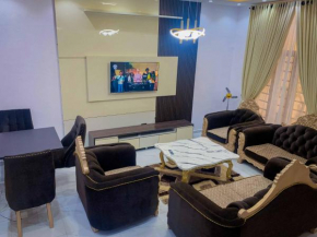 Luxury private one bedroom with a central seating room and bar
